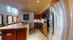 Fully equipped kitchen featuring granite counter tops